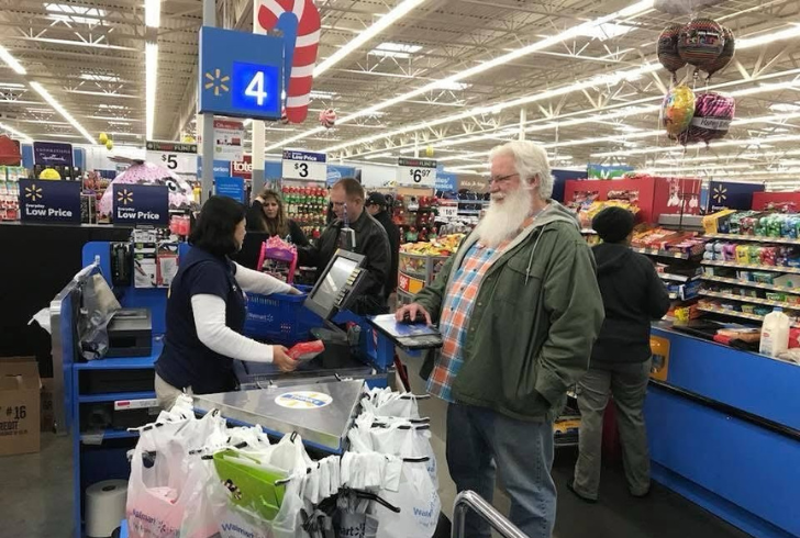 Walmart customers at checkout counter