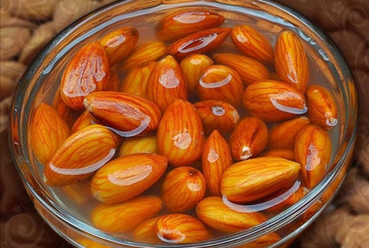 Bowl of soaked almonds ready to eat after soaking overnight