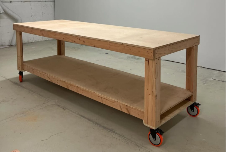 Rolling plywood workbench in garage