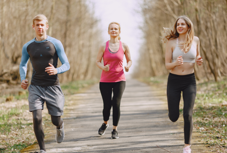 People jogging under soft sunlight