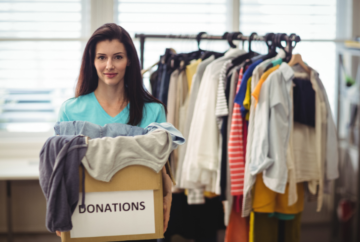 Feamle holding clothes box for donation